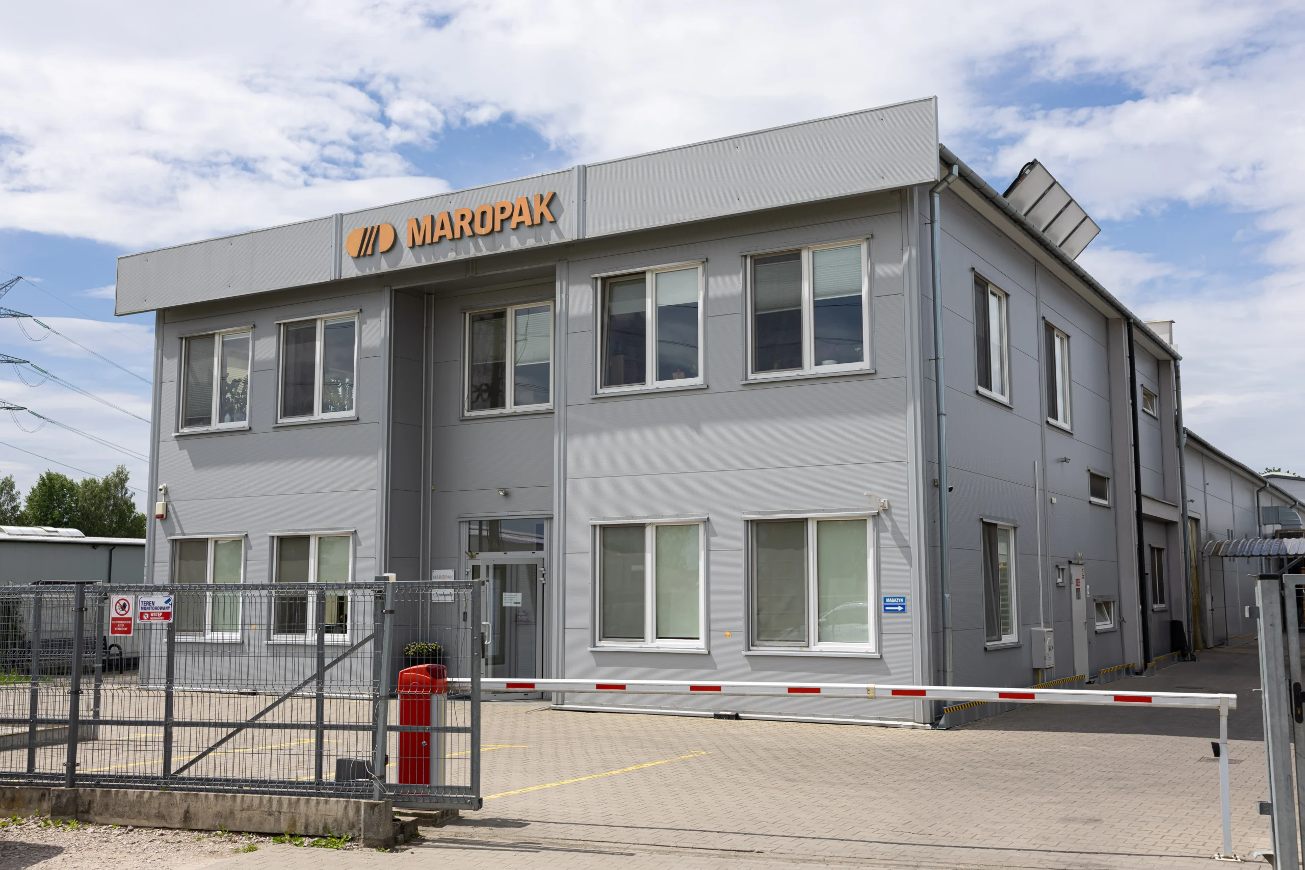 Maropak company building with the logo on the facade and an entrance gate