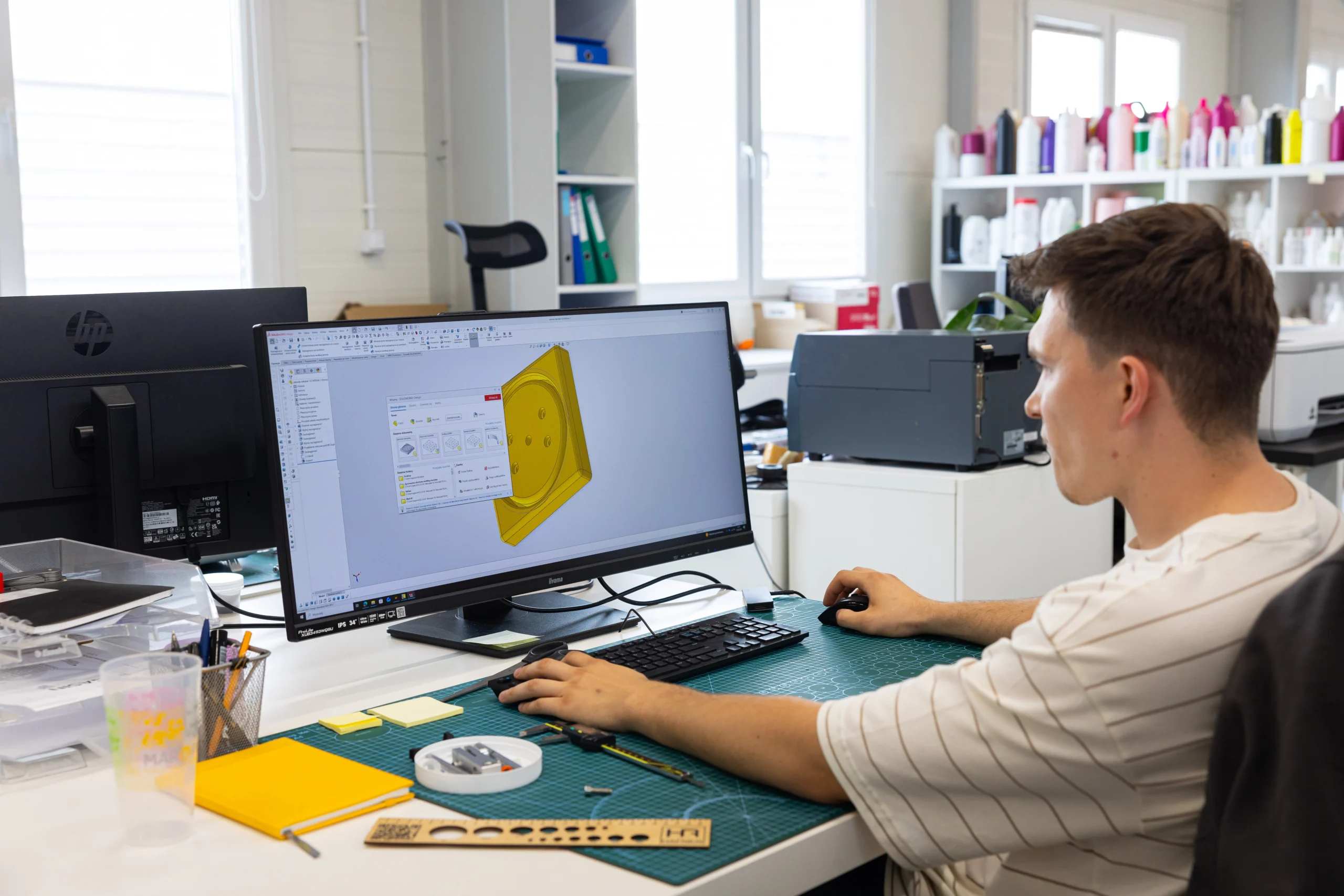 Packaging designer working on a 3D model on a computer