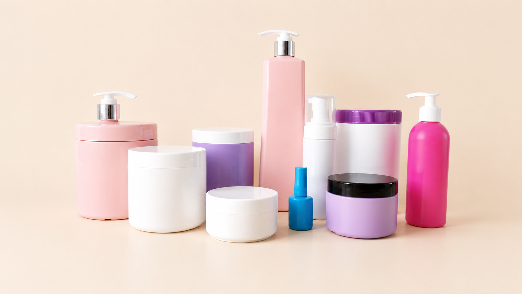 Pastel plastic cosmetic bottles with pumps, jars and containers